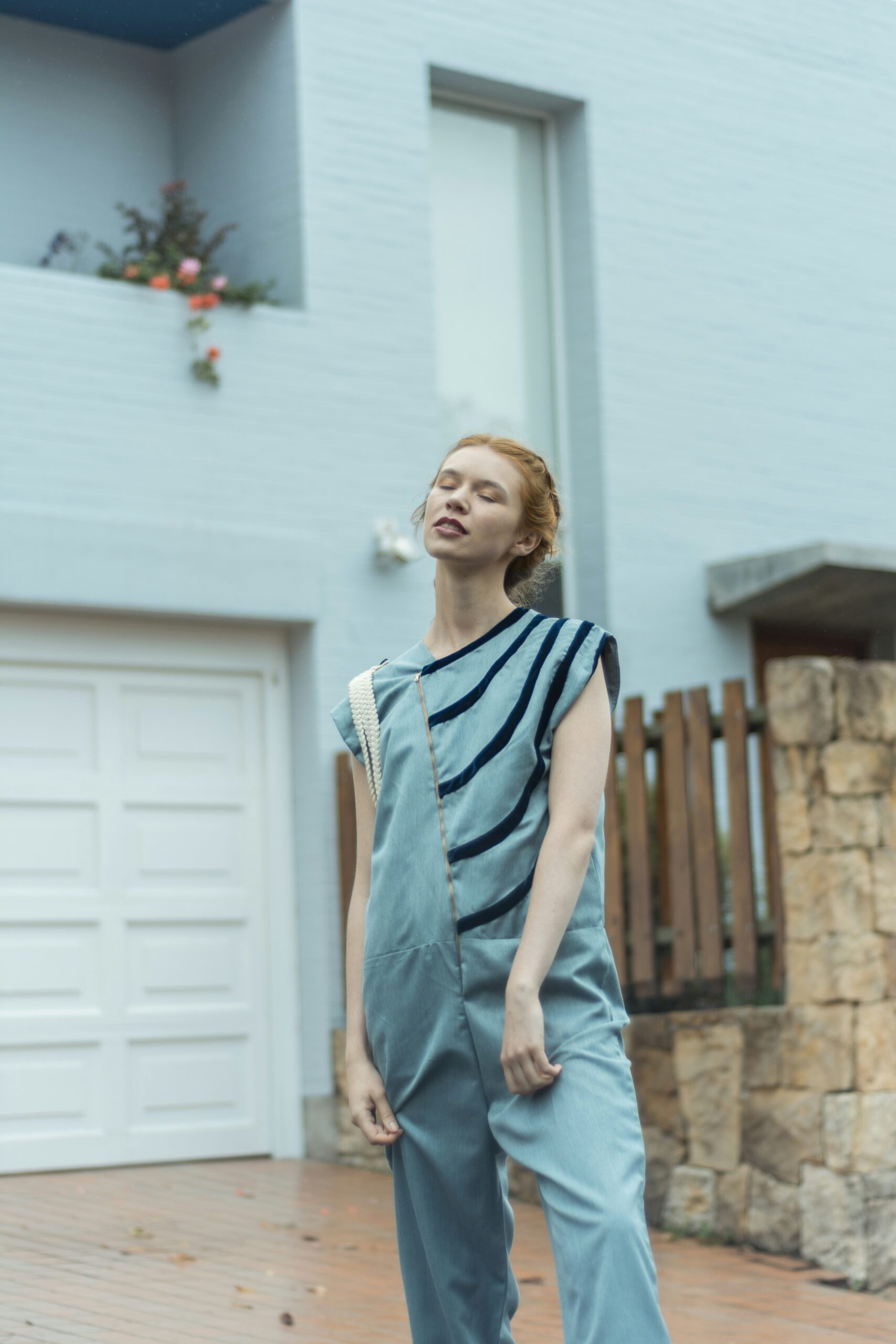 woman standing near house